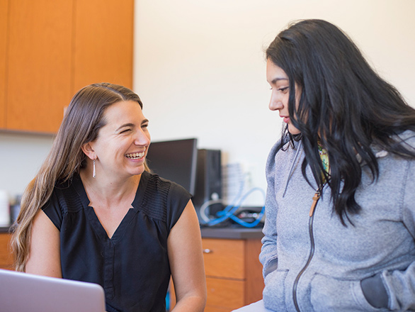 A woman talking to a health care provider.