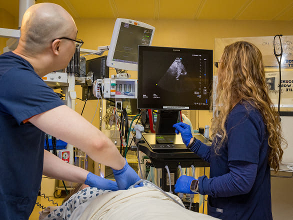 Med students working an emergency medical simulation