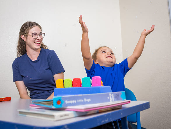 A provider with an excited child