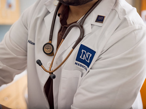 Close up of a UNR Med doctor's lab coat and stethoscope