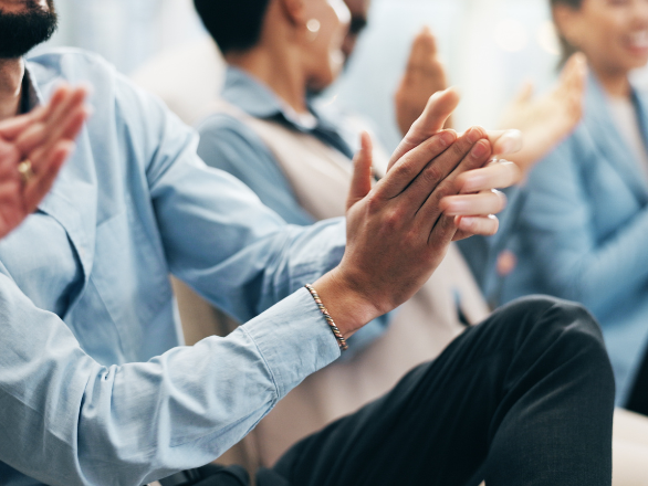 People's hands and team applause in conference