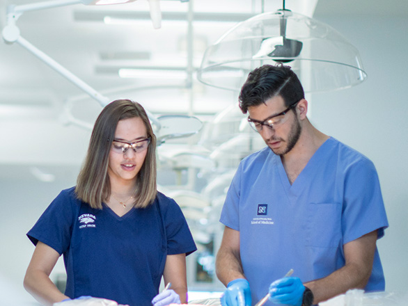 Two students working in the anatomy lab