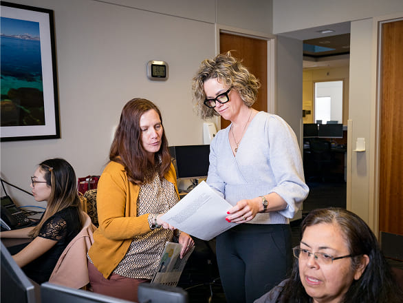 Data scientists look at printouts