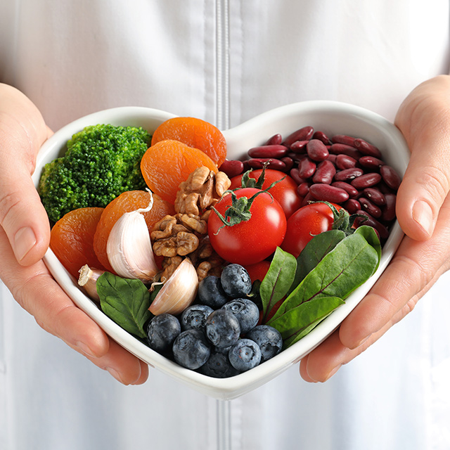 Doctor holding a bowl of fruit