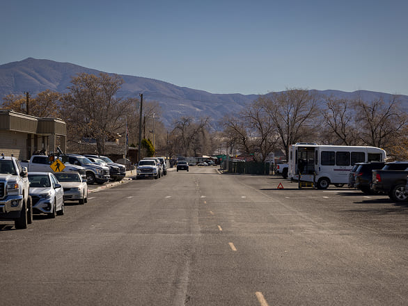 Rural Nevada street with mountains in the background.