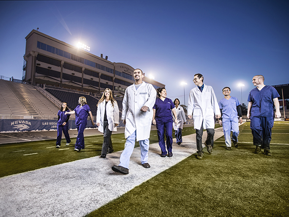 Students Walking on the football field