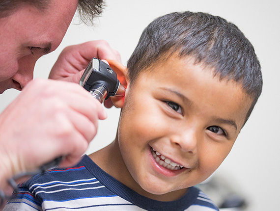 Child getting an ear exam