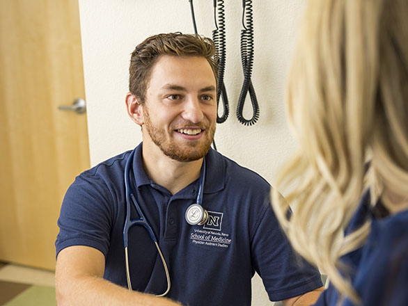 Physician Assistant covering a patients wound with gauze in a clinical setting 