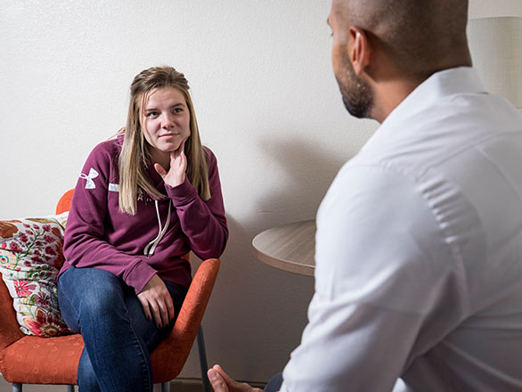 patient in a clinical setting with health care professional