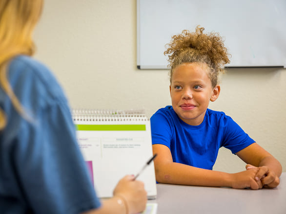 A girl patient smiles at the doctor