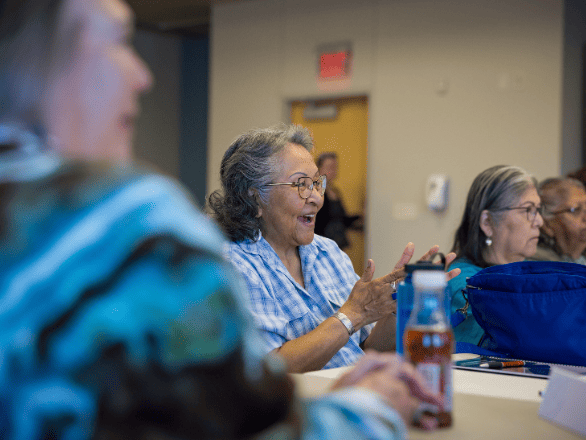A woman smiling during a workshop