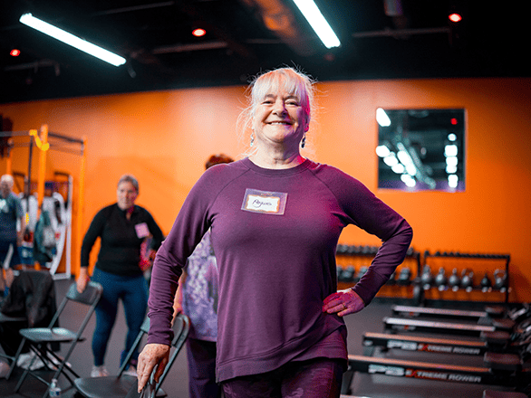 an older woman exercising in a gym