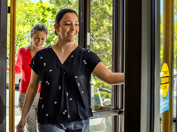 healthcare professionals walking through door