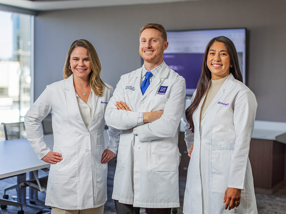 Doctors posing and smiling