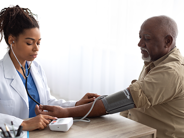 Geriatric medical professional with patient in clinical environment