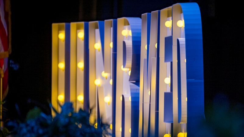  Illuminated sign displaying UNR MED prominently lit up