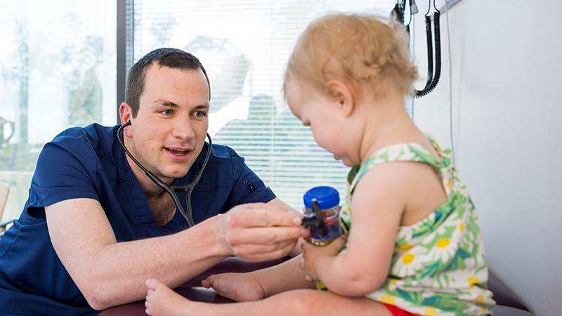 health care student with patient in a clinical setting