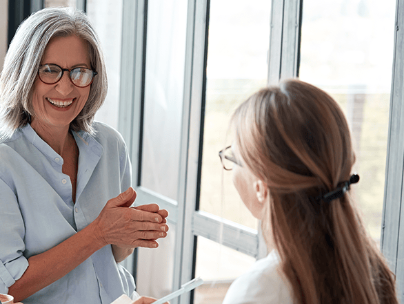 mentor advising student in an office setting