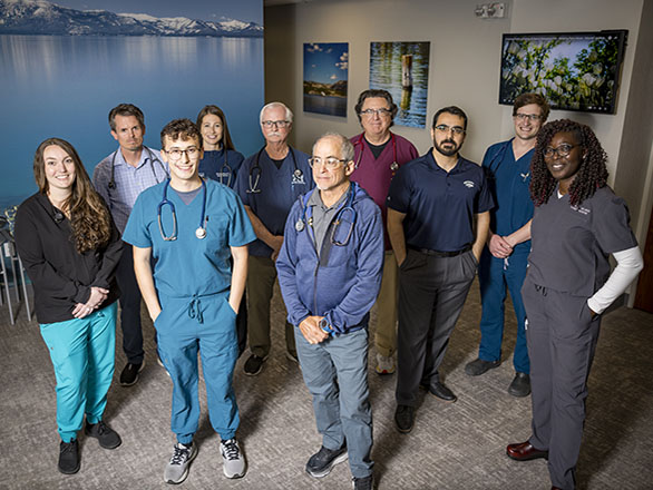 UNR MEd faculty and students posing in a clinic waiting area