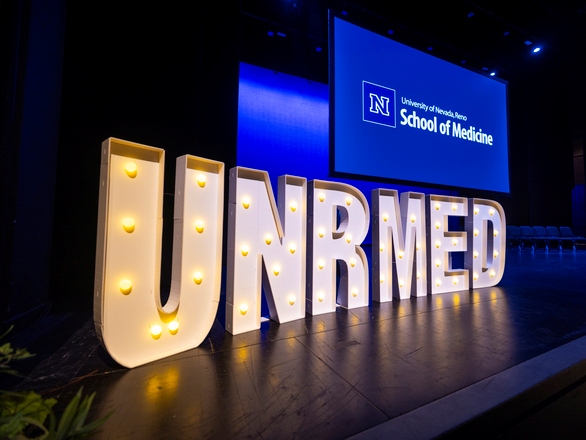 UNR Med sign illumined 