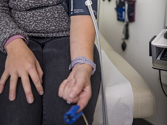 A patient getting their blood pressure measured.