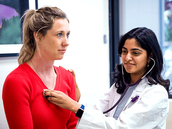 clinical researcher working with a patient
