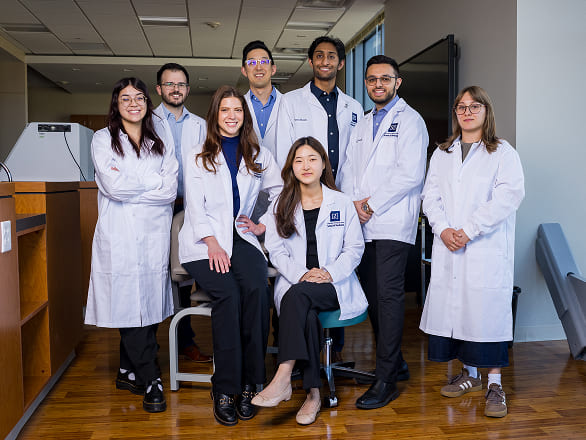 A research team posing together for a group shot